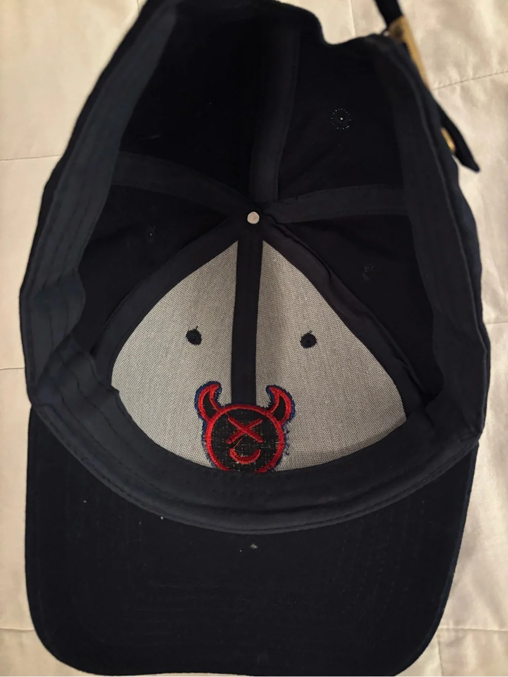 Source Unknown Black Cap with Red & Blue Devil Emblem